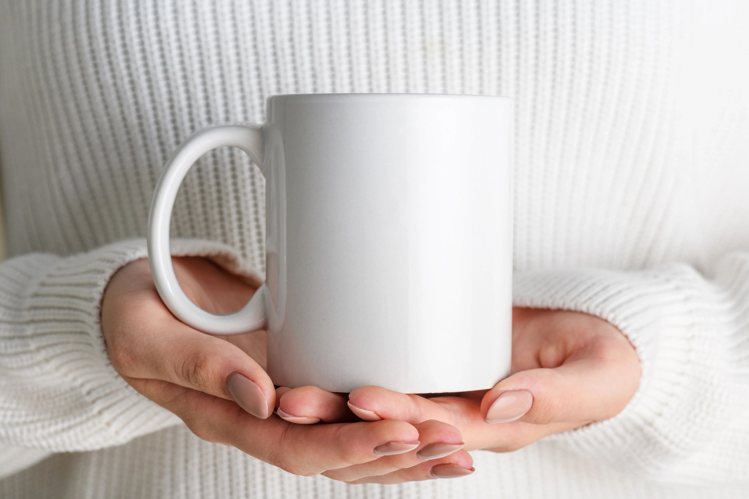 Hands holding a mug used as a customer avatar placeholder