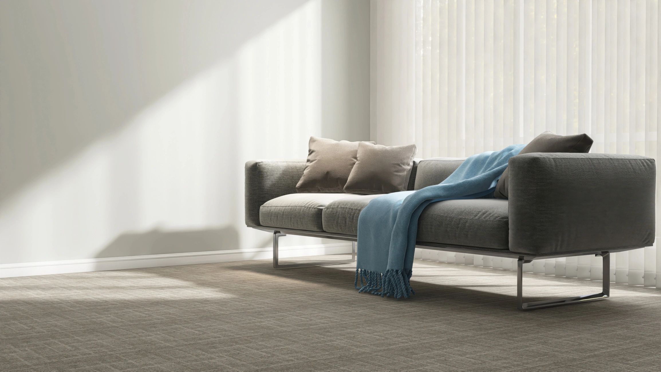 Minimal living room with grey sofa and blue throw