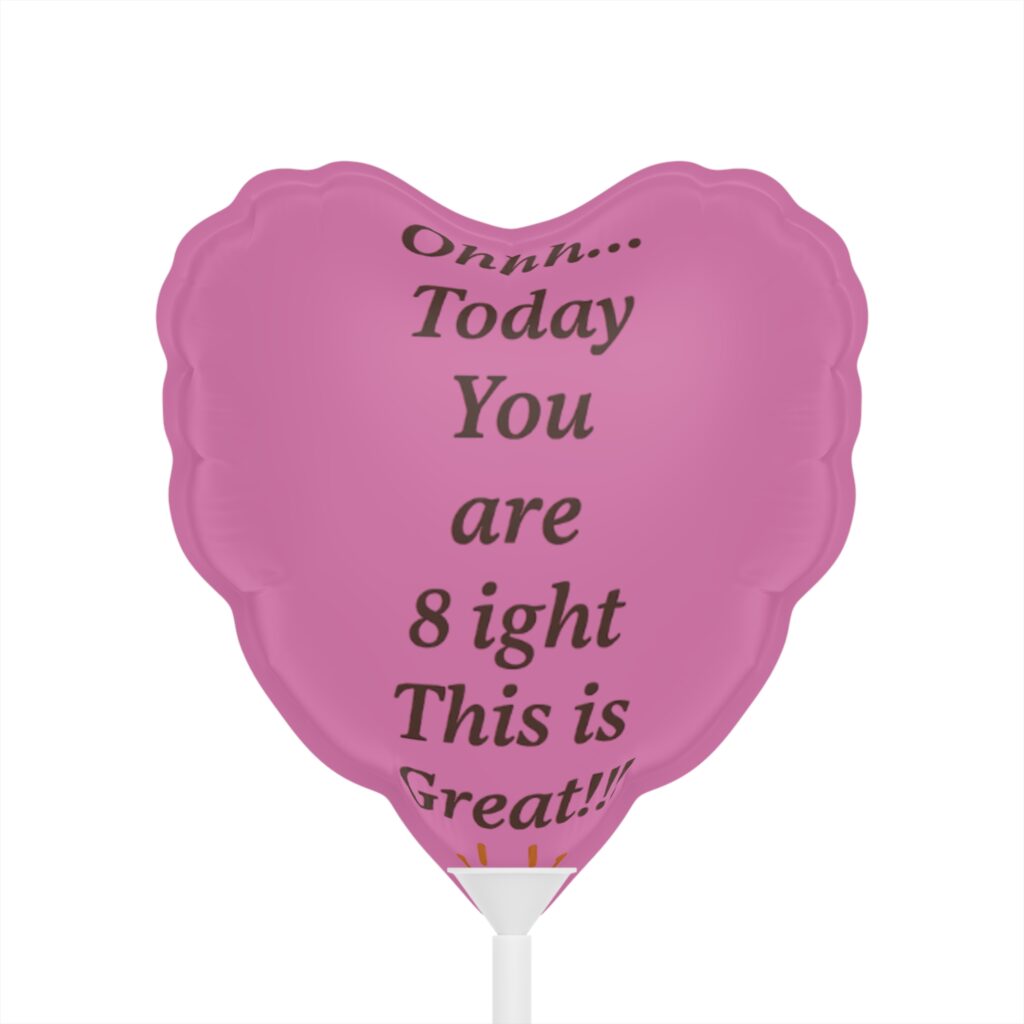 Pink heart-shaped balloon with printed message