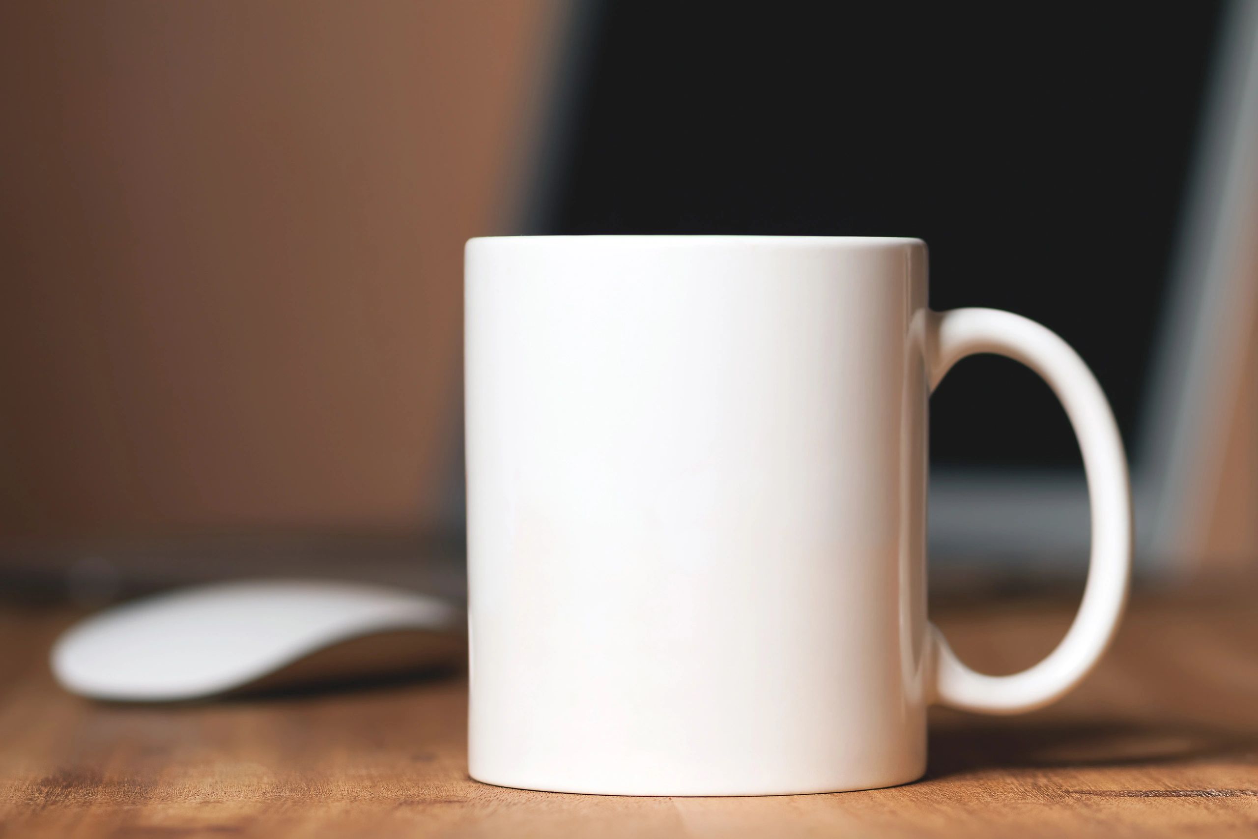 White mug on a wooden desk