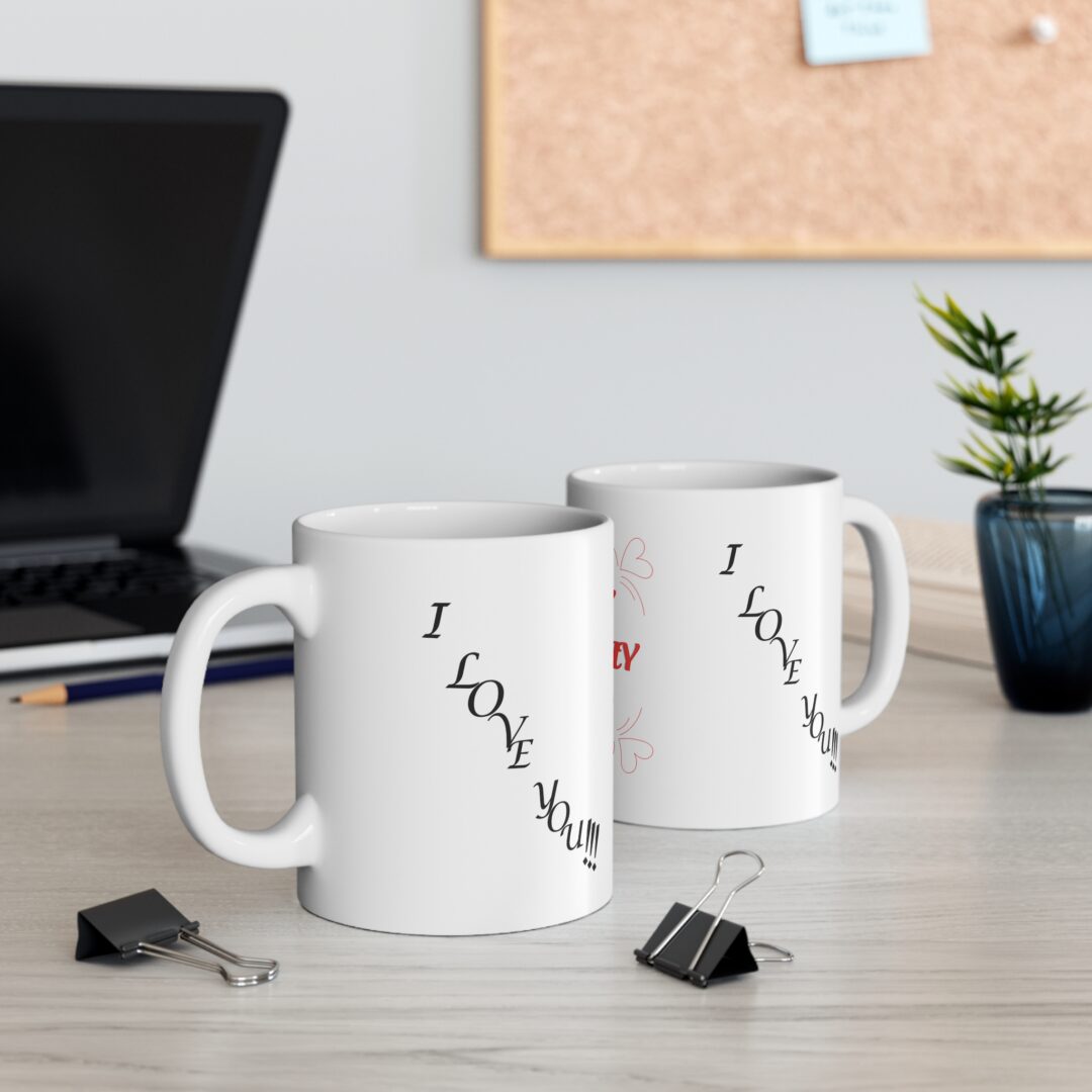 Two white mugs on office desk